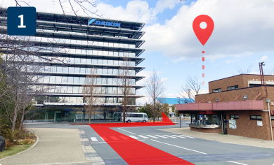 Proceed straight from the main gate and turn right from the front of the glass building (TIC).
